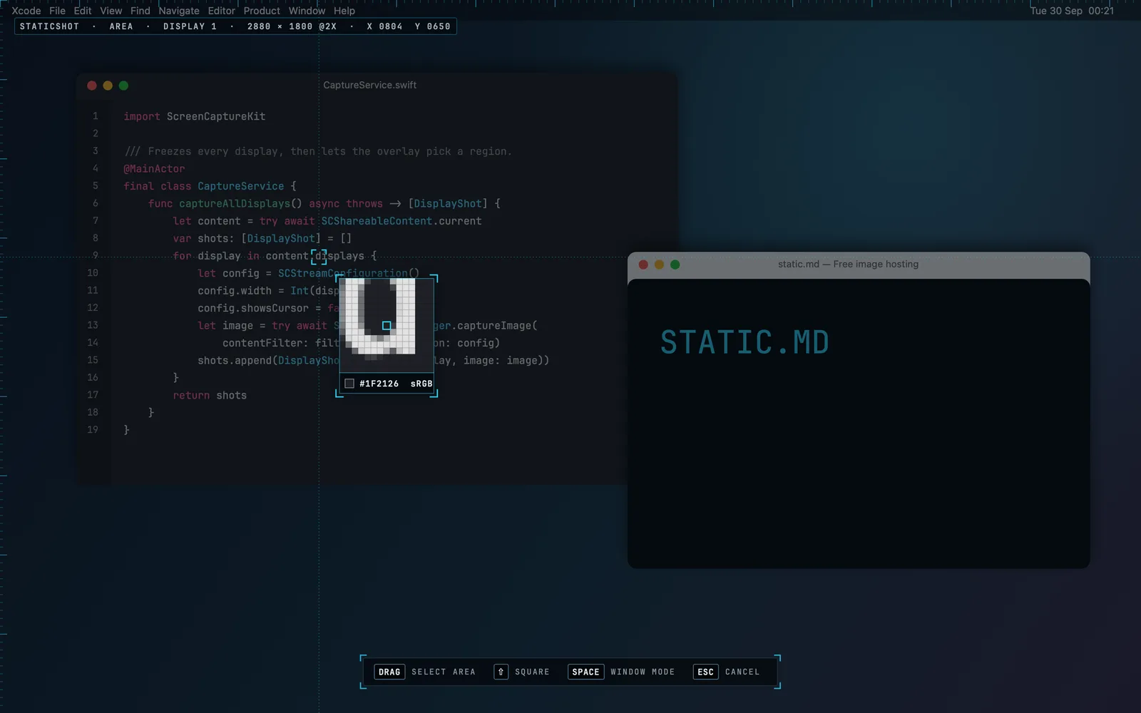 StaticShot magnifier: a 15-pixel loupe over code showing the exact colour under the crosshair, #1F2126